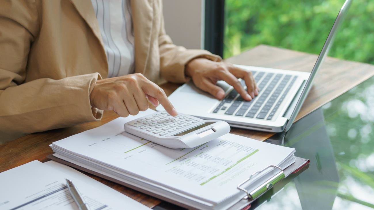 Business professional reviewing purchasing costs and financial data