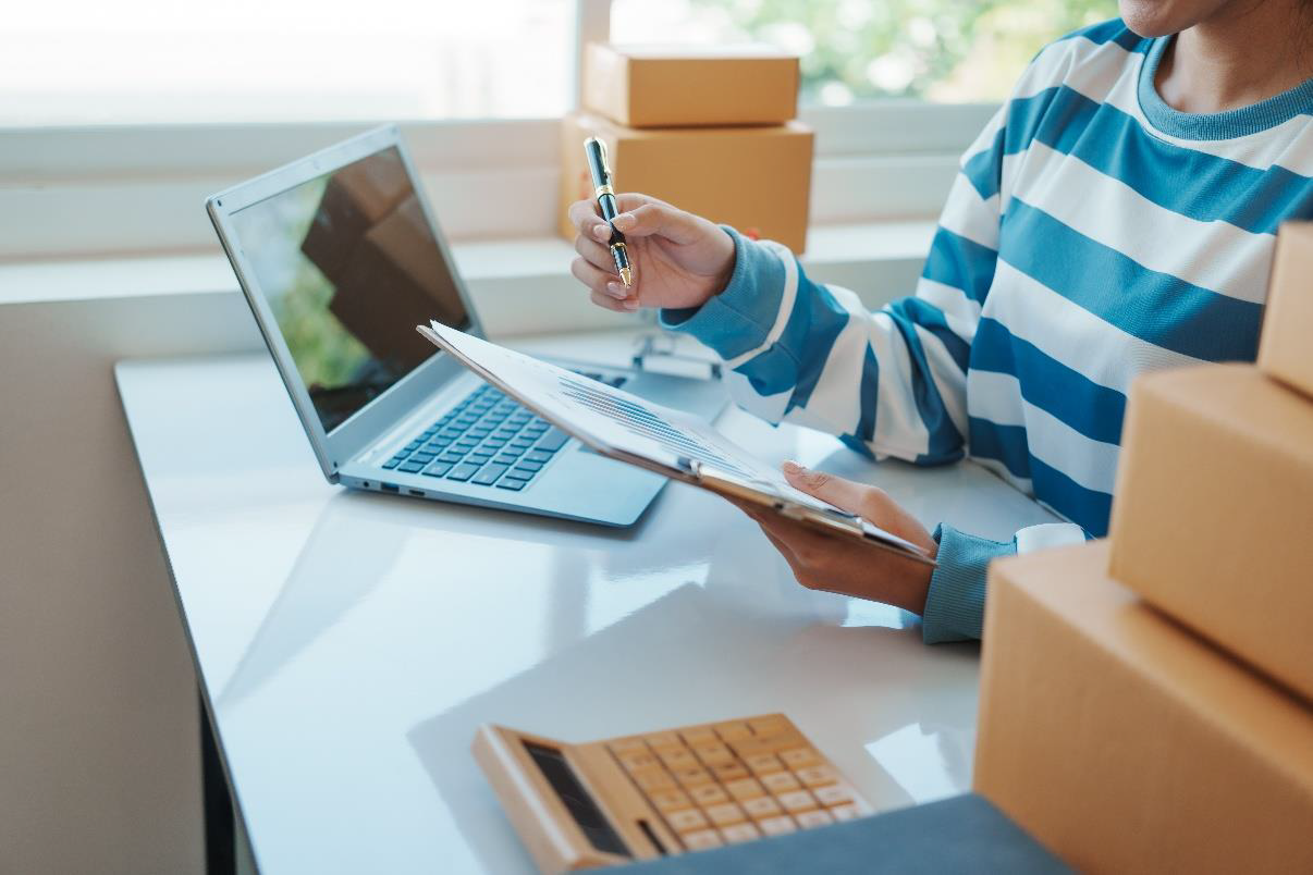 Employee reviewing shipment and order information
